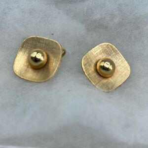 Vintage mid-century Emmons gold colored clip earrings.